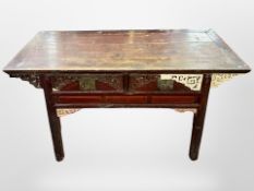 A 19th century Chinese carved and lacquered elm altar table,