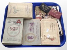 A tray of cigarette cards, including association football, sea fishes, aeroplanes,