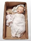 An early 20th-century ceramic headed jointed doll, stamped '24 Germany 5',