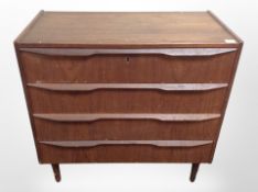 A Danish teak and pine four drawer chest,
