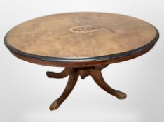 A Victorian walnut and ebonised oval dining table,
