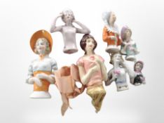 A group of porcelain half dolls.