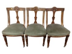 A set of six carved oak salon chairs upholstered in green dralon