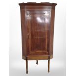 A George III mahogany and satin wood banded corner cabinet,