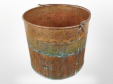 A 19th century copper and brass swing handled bucket,