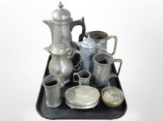 A group of 19th-century pewter wares including teapots, tankards, oval dressing table, box, etc.