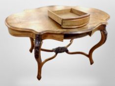 A 19th century carved oak shaped top occasional table on cabriole legs, drawer as found,