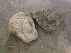 A concrete cherub garden wall pocket, width 39cm, and a further depicting a lady.