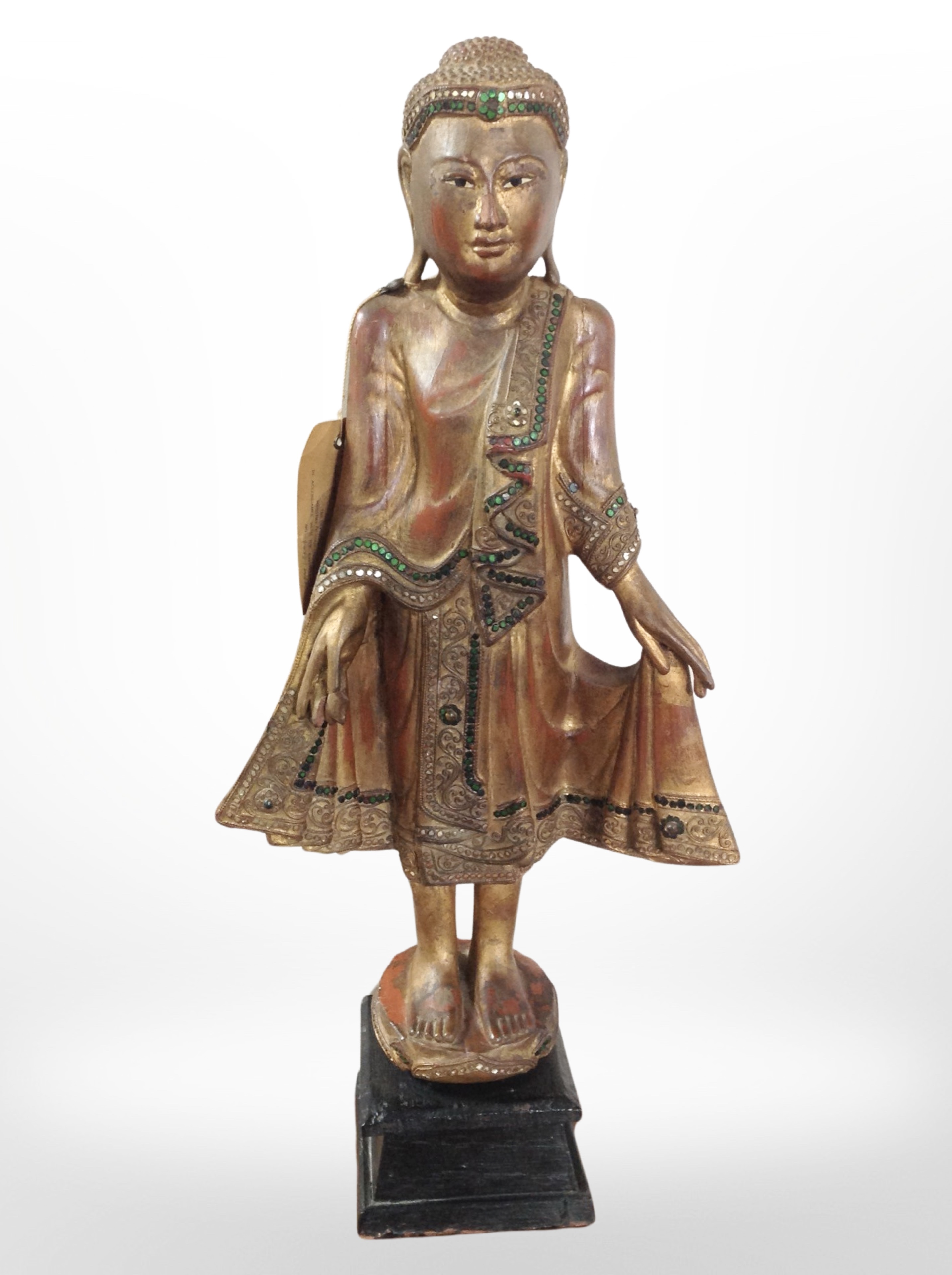 A Thai giltwood and 'jewelled' figure of Buddha, height 65cm.