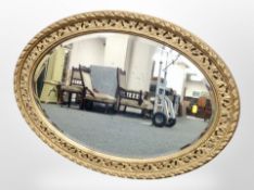 A Victorian gilt gesso oval mirror,