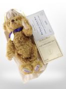 A Danbury Mint Golden jubilee bear, limited edition No. 0761, with certificate and cloth carry bag.
