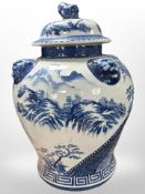 A reproduction Chinese blue and white porcelain lidded temple jar, height 50cm.
