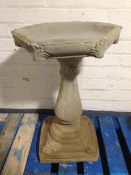 A concrete hexagonal bird bath, height 69cm.