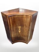 A 19th century mahogany and satinwood inlaid inverted bow fronted corner cabinet,