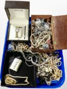 A group of costume jewellery including faux pearls, necklaces, brooches,