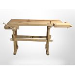 A Scandinavian pine work bench fitted with two vice,