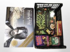 A Criss Angel Magic Kit and a further box containing magic and coin trick sets.
