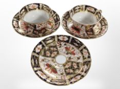 Two 19th-century Royal Crown Derby Imari tea cups and three saucers.