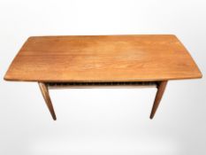 A Danish teak rectangular two tier coffee table 125 cm long x 53 cm wide x 53 cm high