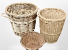 Three wicker baskets, tallest 49cm.