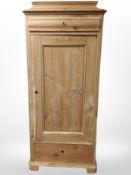 A 19th century Continental pine sentry door cabinet,