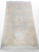 A silk piled Chinese rug,