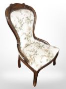 A Victorian style lady's chair in floral upholstery