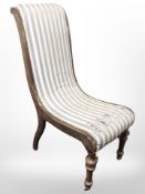 A 19th century beech salon chair in striped upholstery