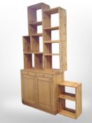 A pine double door cabinet and a six part pine modular bookshelf