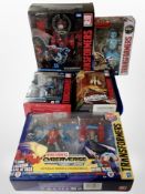 Five Hasbro Transformers models, boxed.