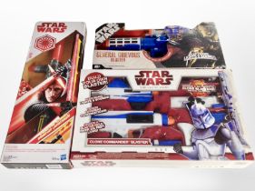 A Hasbro Kylo Ren's Spring-Action Lightsaber, and two further Star Wars blaster gun sets,