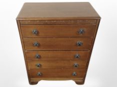 A Lebus Furniture oak five drawer chest,