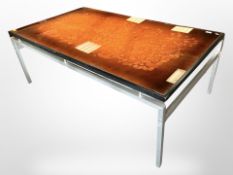 A 20th century Danish metal framed glass topped coffee table,