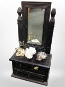 An ebonised dressing table mirror fitted three drawers,