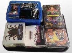 A group of trading cards : Warhammer Age of Sigmar, Power Rangers, Naruto, etc.
