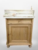 A Victorian pine side cabinet on bun feet, the marble top as found,