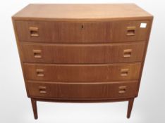 A Danish teak bow fronted four drawer chest,
