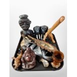 A group of ethnographic carvings, wall mask, pair of ebony figures of elephants, carved hand mirror,