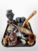 A group of ethnographic carvings, wall mask, pair of ebony figures of elephants, carved hand mirror,