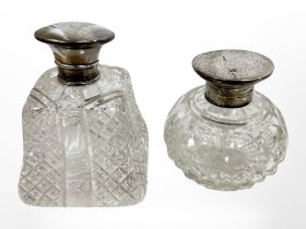A silver-topped crystal dressing table bottle plus one other, tallest 10cm.