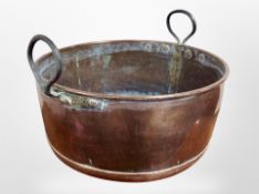 A 19th century copper twin handled pot,