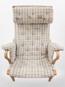 A 20th century Danish bentwood and canvas armchair in checkered upholstery,