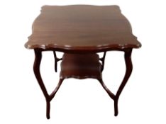 An Edwardian mahogany two tier occasional table,