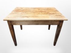 A 19th century French fruitwood kitchen table,