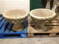 A pair of concrete classical-style garden planters, height 43cm.