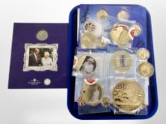 A collection of gold-plated commemorative coins including royalty, the Royal Air Force, etc.