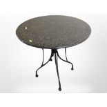 A granite topped patio table,