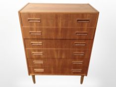A Danish teak and MDF six drawer chest,