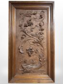 A continental carved walnut panel, 34cm x 60cm.