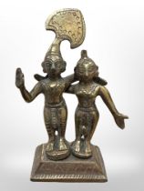 A 19th century Tibetan brass devotional temple statue, height 10cm.